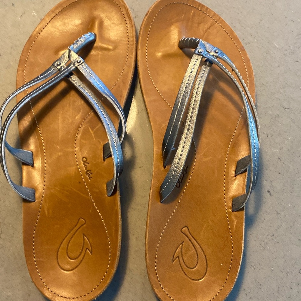 OluKai Metallic Silver Strappy Tan Leather Flip Sandals